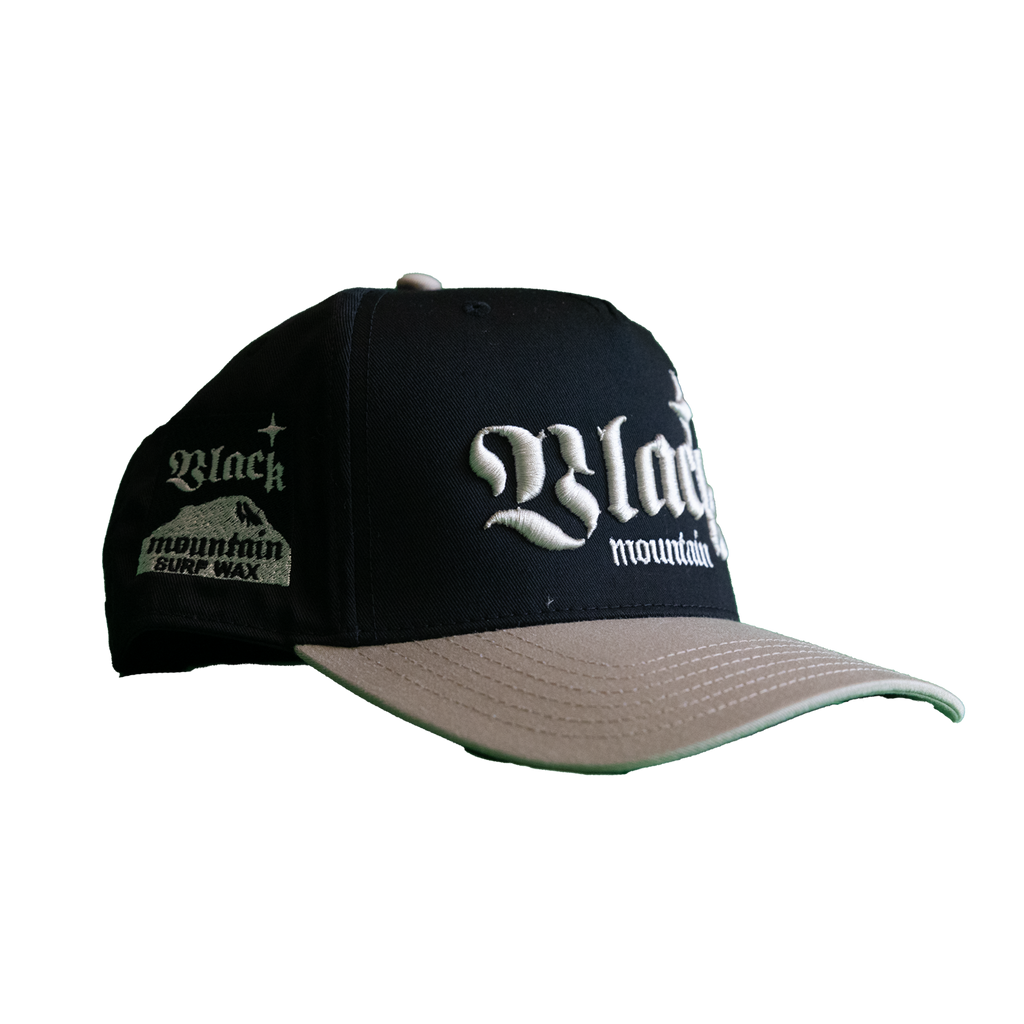 The Black Mountain Snapback Hat — Black with Tan Brim